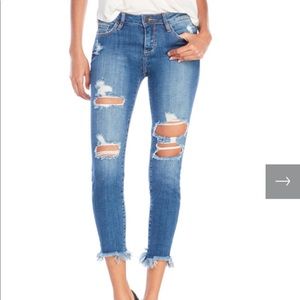 Distressed denim with Step Raw Hem